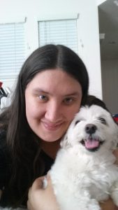 Dog Trainer Lindsey with one of her canine students learning advanced behavior